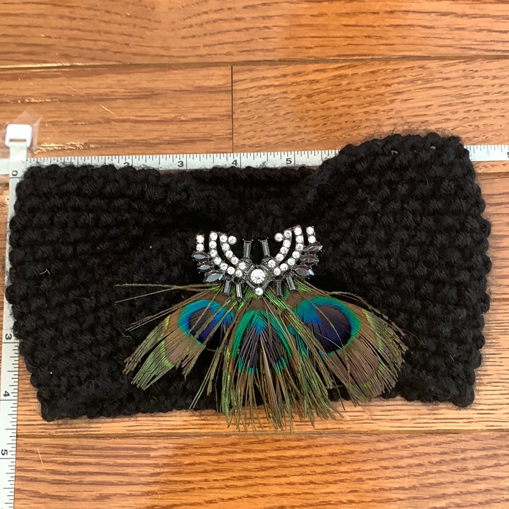 Adorable, chic, warm, knit winter headband with feather/jewel detail!